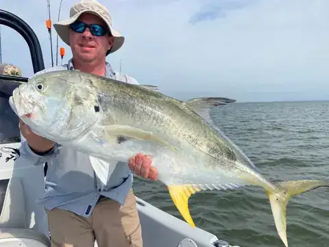 Angler holding a jack crevalle near Venice, Louisiana
