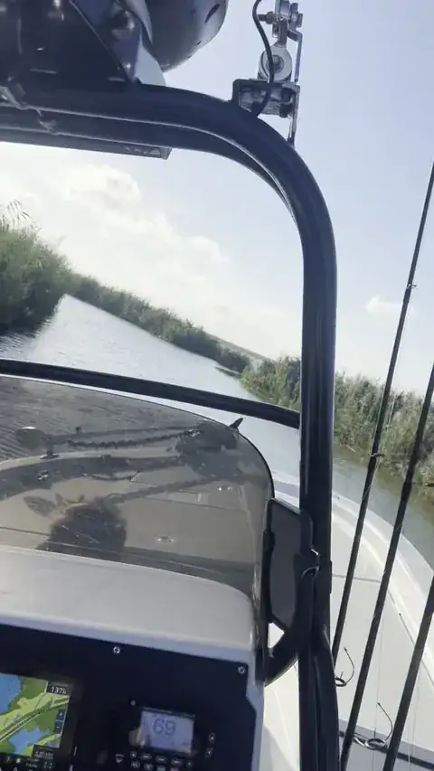 Video: running along a marsh channel, seen from the helm of the boat