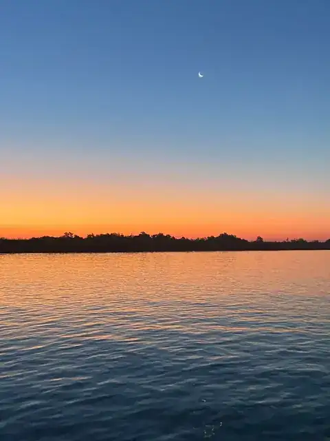 Dawn over calm water in the Venice, Louisiana delta